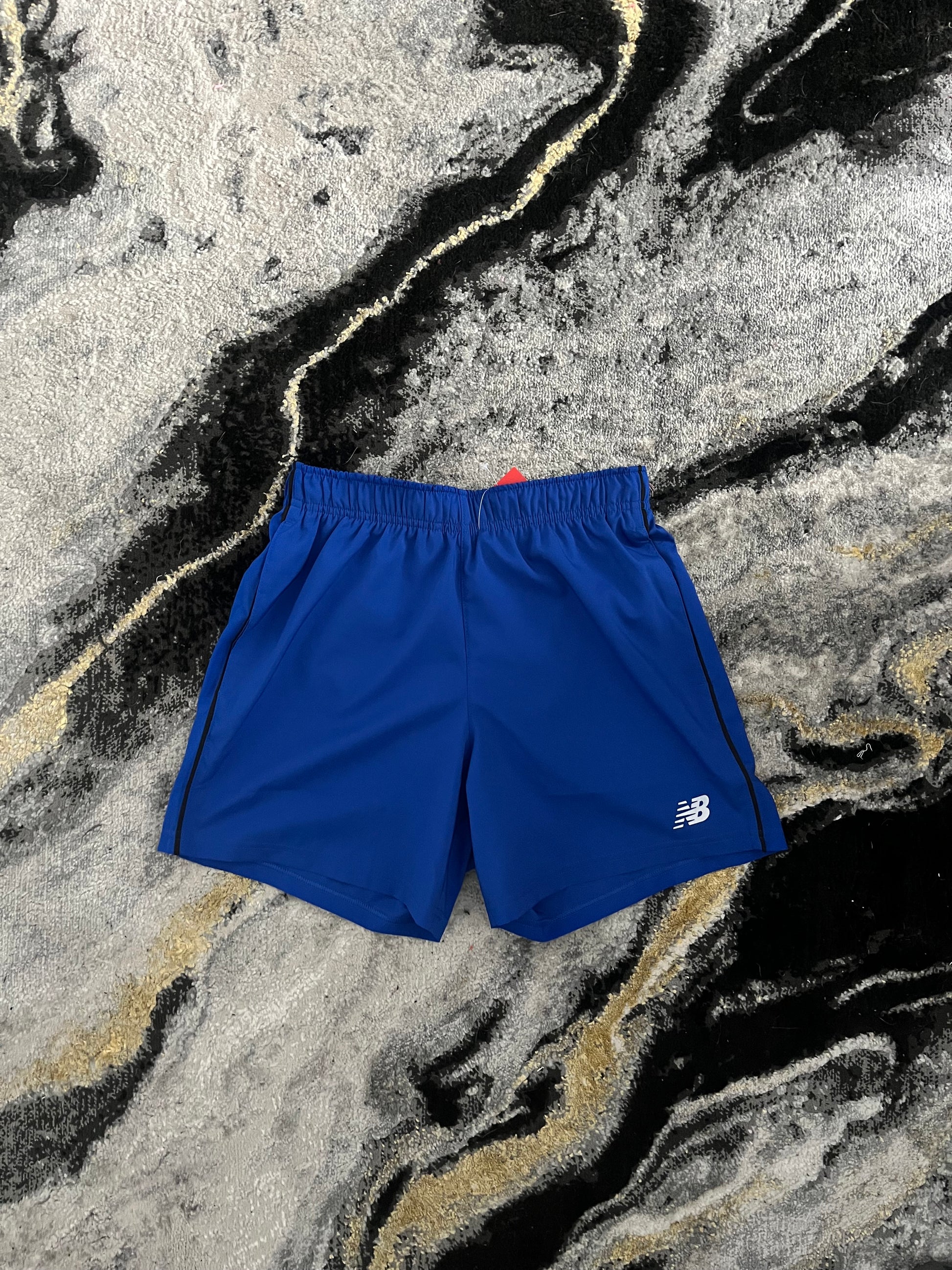 New Balance blue athletic training shorts – lightweight and breathable front view